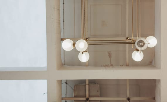 retro vintage lamps hang on the ceiling of an old restaurant