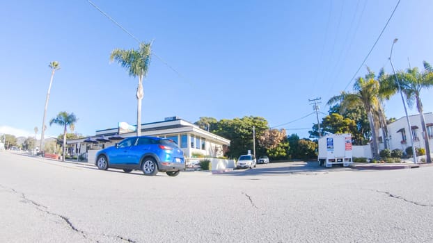 Santa Maria, California, USA-December 6, 2022-Car driving through the streets of Pismo Beach town, California during winter.