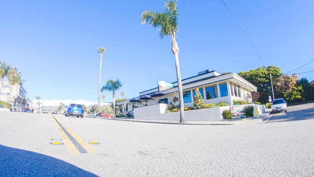 Santa Maria, California, USA-December 6, 2022-Car driving through the streets of Pismo Beach town, California during winter.