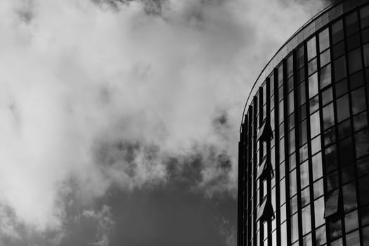 Modern skyscraper with glass facade. Futuristic architecture. Copy space