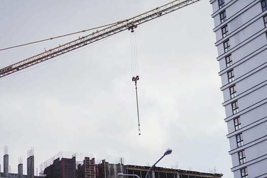 Construction site with crane on sky background. mortgage