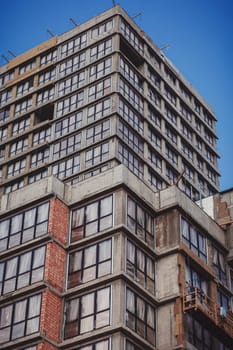 High-rise building under construction with scaffolding