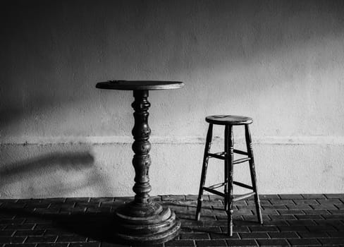 antique table and chair in the cafe. black and white photography