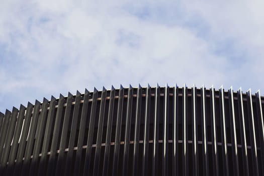 metal modern metal building against the blue sky. futuristic architecture