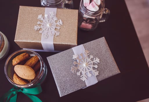 Christmas gifts and cookies on the table. festive mood
