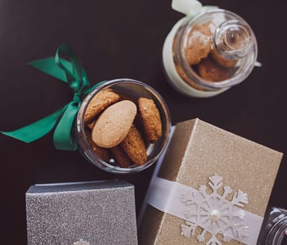 Christmas cookies on the table with gifts. the view from the top