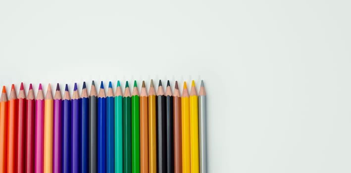 Set of colored pencils on a white background That is arranged in a bar graph, Color pencils on white background, Close up, seamless colored pencils row with wave on lower side, line pencils.