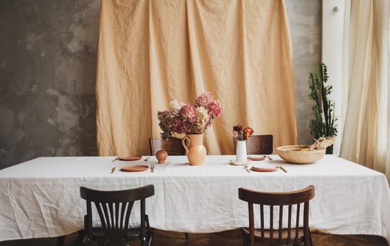 vintage table with rustic dishes. classic interior of europe