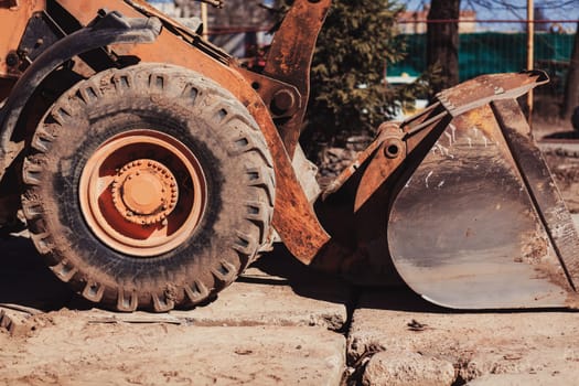 large excavator with a bucket at construction site