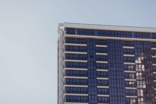 Fragment of Modern residential apartment with flat buildings exterior. Detail of New luxury house and home complex.