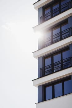apartment buildings on a sunny day with a blue sky. Facade of a modern apartment building