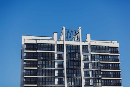 residential modern building against the blue sky. Realty