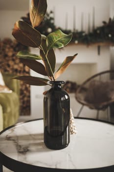 small pot with a plant stands in a beautiful modern interior