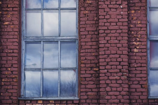 old brick building with large windows in Europe. old architecture