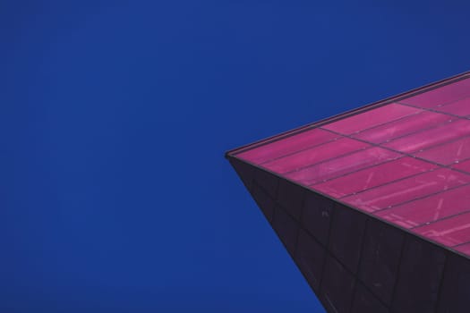 corner of a modern glass building. futuristic architecture