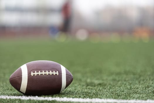 American Football with the Fifty Yard Line Beyond. High quality photo