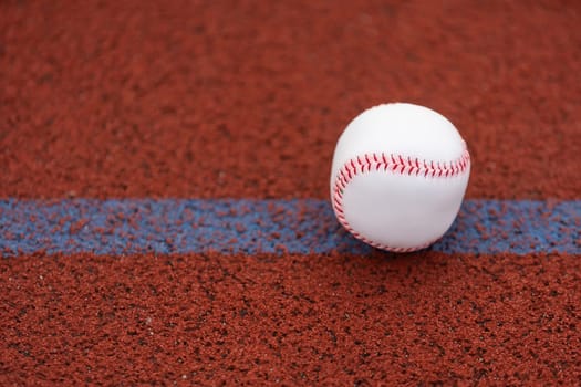 one baseball on infield of sport field. High quality photo