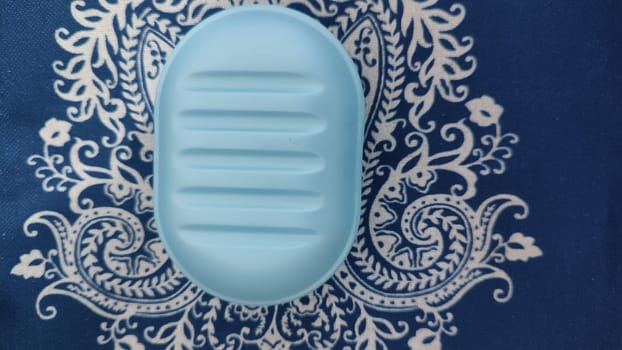 blue plastic soap dish for soap, hygiene object. High quality photo