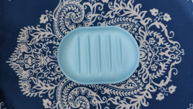 blue plastic soap dish for soap, hygiene object. High quality photo