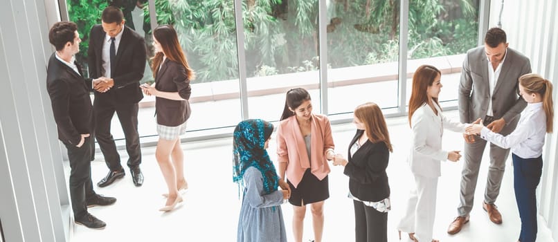 Many business people gathering in modern office building for business conference in the city. Businessmen and businesswomen communication and human resources concept. uds