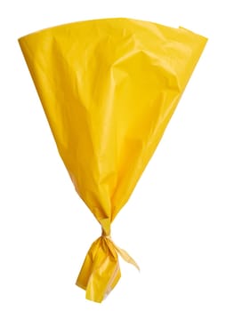 Yellow plastic bag on isolated background, close up