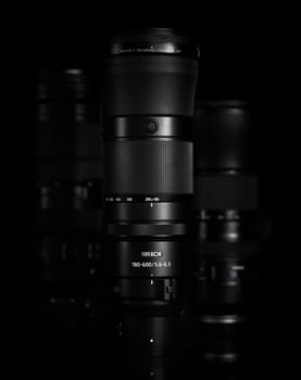 Super telephoto lenses on a black background. The NIKKOR Z 180-600mm f 5.6-6.3 VR in the foreground. Professional photo and video optical lenses for digital camera. 20.02.2024, Yerevan, Armenia