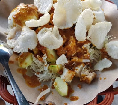 CNN winning top food, Typical Indonesian healthy food, often called gado gado, or lotek, consists of various vegetables, eggs, tempeh, and lontong with peanut sauce, street food