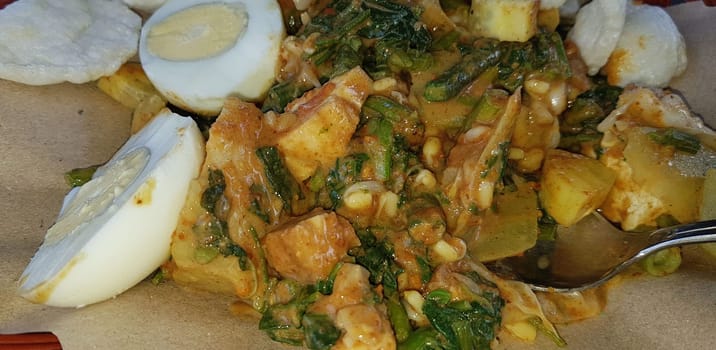 CNN winning top food, Typical Indonesian healthy food, often called gado gado, or lotek, consists of various vegetables, eggs, tempeh, and lontong with peanut sauce, street food