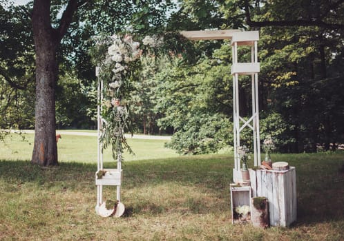 wedding decorations. arch for the newlyweds in the woods