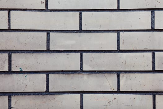Grey wall background. Old grungy brick wall horizontal texture. 