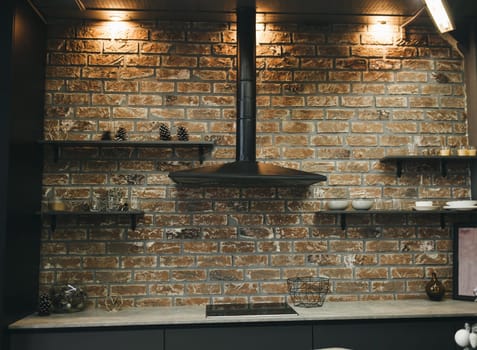 loft kitchen interior with brick wall. stylish design of a modern apartment
