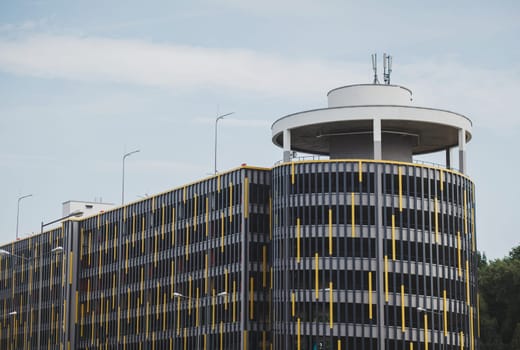 Modern parking lot, round building exterior, abstract fragment