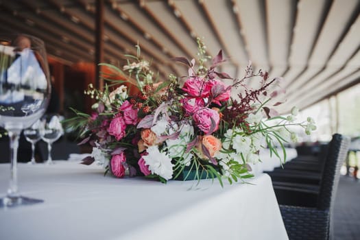 Beautiful bouquet of wedding flowers on the restaurant table