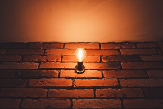 old vintage lamp on a brick wall