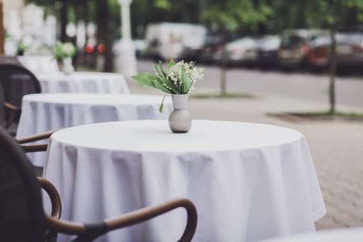 Charming traditional french cafe with tables on terrace 