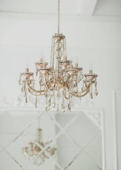 Modern crystal chandelier in classic interior