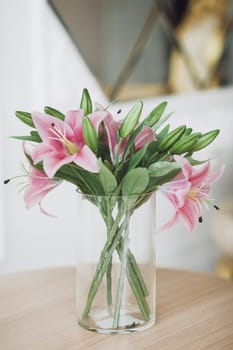 Bouquet of flowers in glass vase on table
