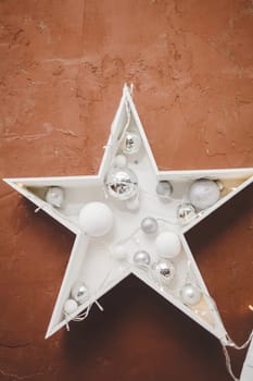 Christmas garland star hanging on the wall