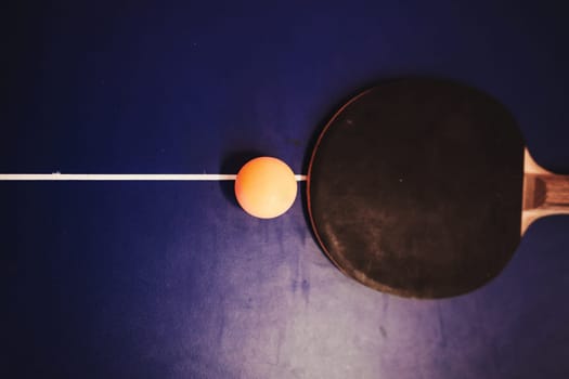 Table tennis or ping pong racket and bals on table