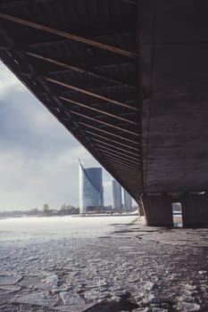 winter river Daugava with a view of the modern building in Riga