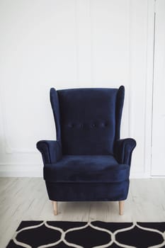 classic light interior of the apartment with a vintage chair