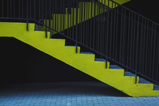 yellow steps in the parking lot. emergency exit