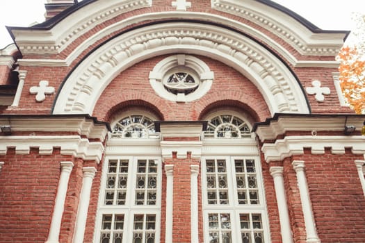 antique brick Church with white old Windows