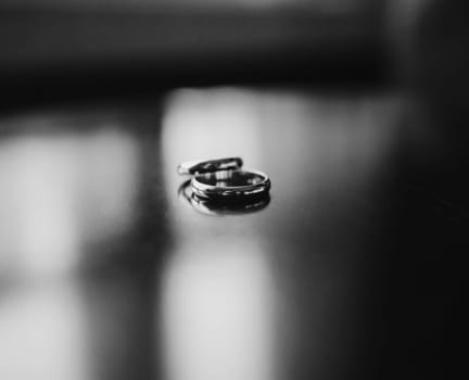 Two wedding rings on table. Love concept.