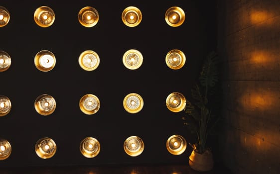 Loft interior design. Wall with built-in light bulbs