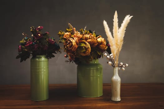 still life of various flowers. photo of flowers in pots with light