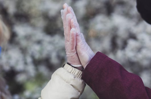 gloved lovers greet each other during the coronavirus pandemic