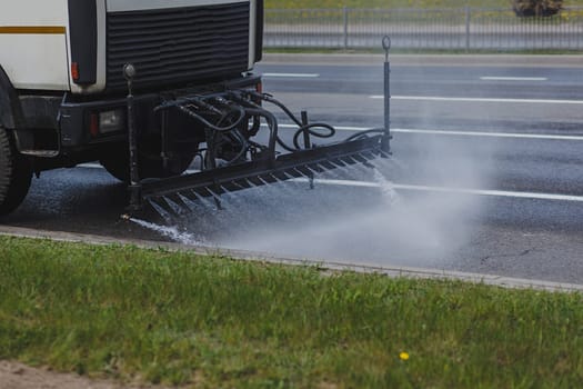 truck clears the city of dust and dirt. prevention of the coronavirus pandemic
