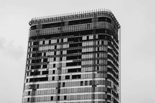 unfinished modern glass building. black and white