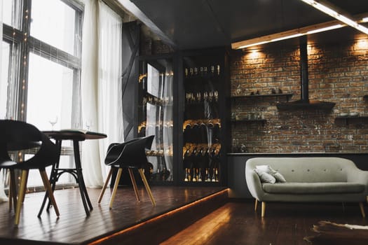 Spacious living room with sofa and dining table. loft interior